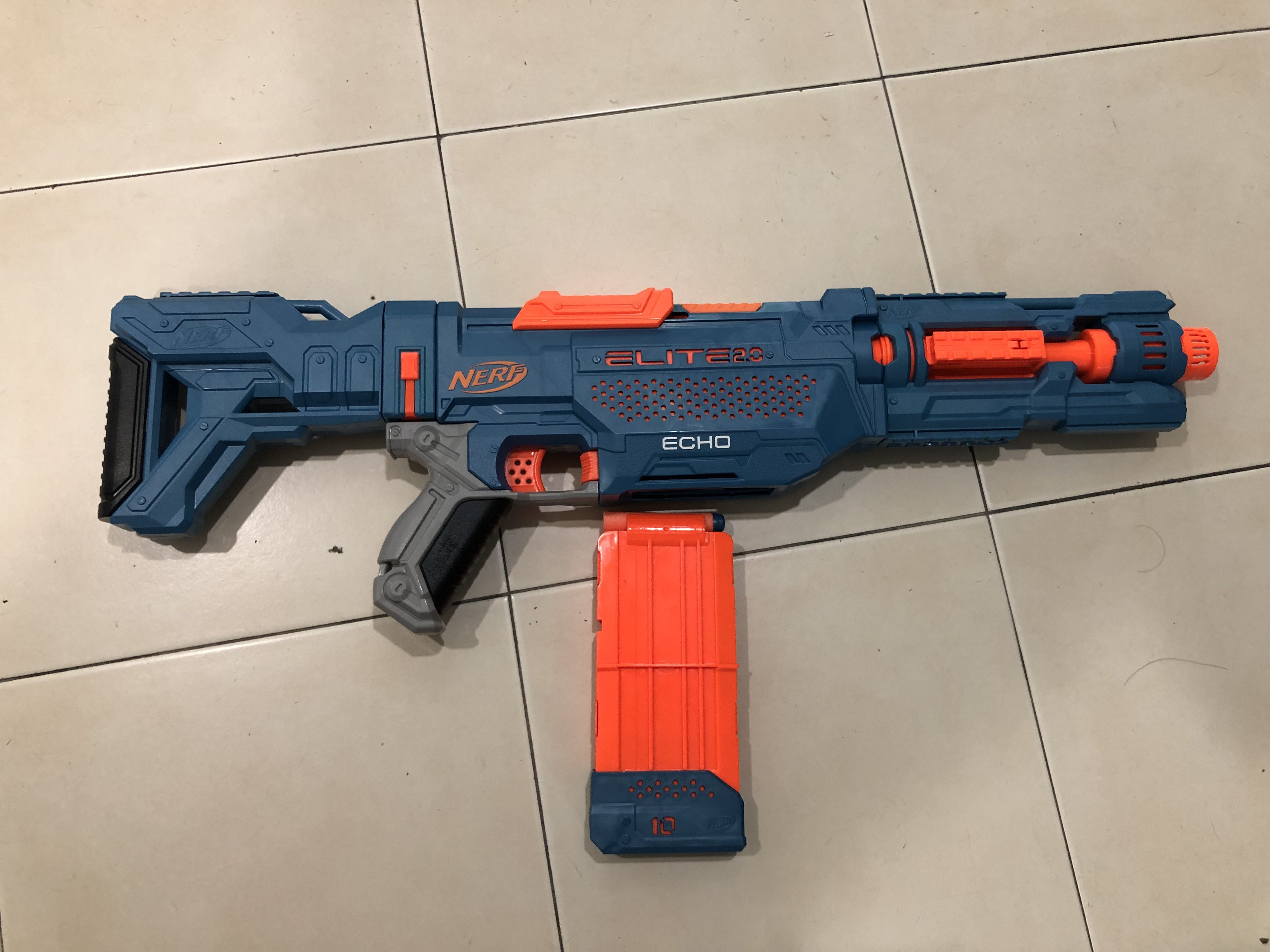Nerf Rifle Nerf Elite Echo 10 Blaster What Is Included In A Nerf Blaster CS-10 Blaster - 24 Official Darts, 10-Dart Clip, Removable Stock And Barrel Extension, 5 Tactical Rails Nerf Elite
